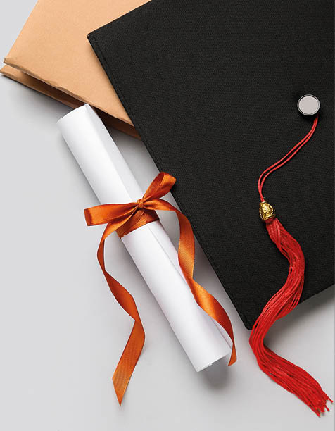 Diploma with red ribbon, graduation hat and book on white background