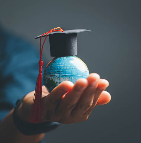 Graduation cap with Earth globe. Concept of global business study, abroad educational, Back to School. Education in Global world, Study abroad business in universities in worldwide. language study