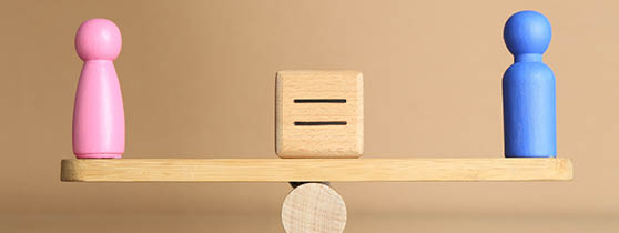 Gender equality concept. Cube with equals sign between male and female figures on scales against beige background
