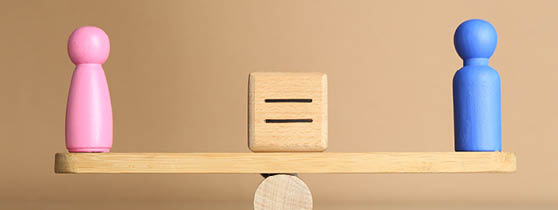 Gender equality concept. Cube with equals sign between male and female figures on scales against beige background