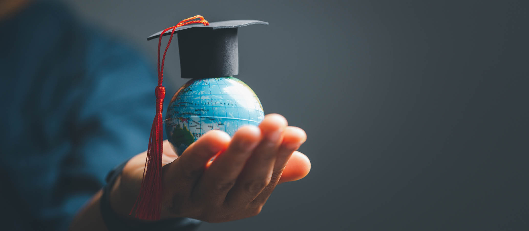 Graduation cap with Earth globe. Concept of global business study, abroad educational, Back to School. Education in Global world, Study abroad business in universities in worldwide. language study