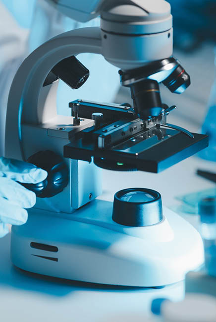 biochemical research scientist working with microscope for coronavirus vaccine development in, Portrait of a Beautiful Female Scientist in Goggles Using Micropipette for Test Analysis.
