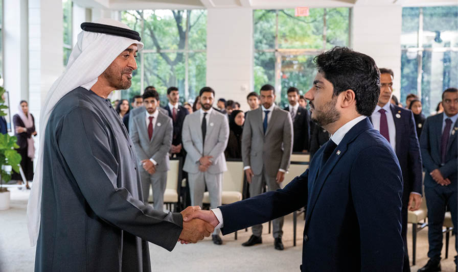 WASHINGTON, DC, UNITED STATES OF AMERICA - September 24, 2024: HH Sheikh Mohamed bin Zayed Al Nahyan, President of the United Arab Emirates (R), greets Emirati students and UAE Astronauts who graduated from the National Aeronautics and Space Administration (NASA) program. Seen during a reception at the UAE Embassy, as part of an official visit to the United States. ( Mohamed Al Hammadi / UAE Presidential Court ) ---