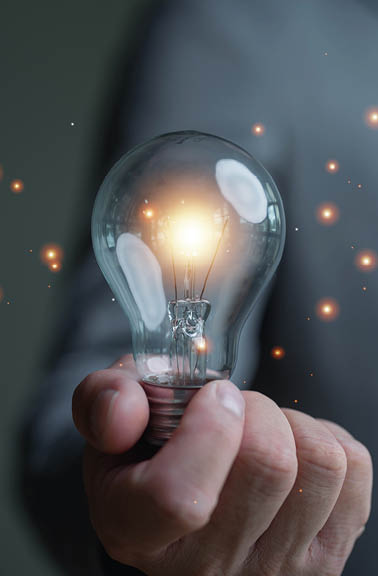 Businessman holding illuminated lightbulb, idea, innovation and inspiration with glowing, smart intelligent creativity with bulbs, Motivation and innovation concept